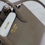 PRADA 1BA071-4 甜美淑女風灰色拼白原版十字紋迷你風琴包